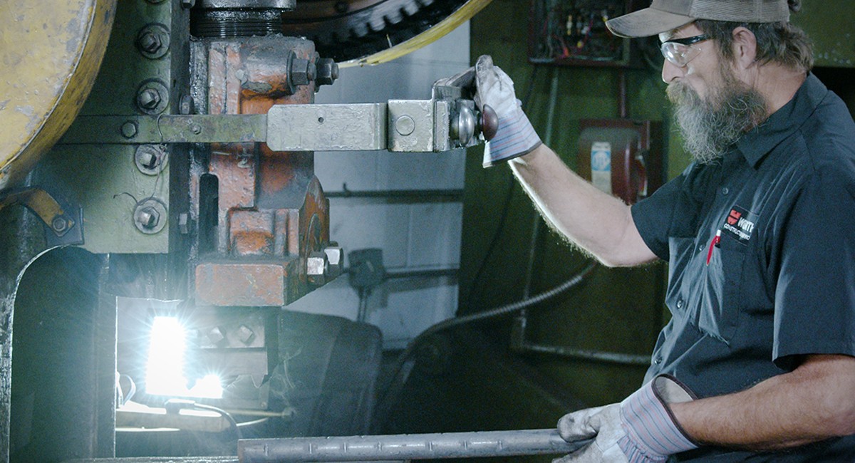 A worker manufacturing custom structural fasteners, a construction solution provided by Würth